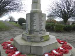 Oblique view of dedications on back of Easington Colliery War Memorial November 2016